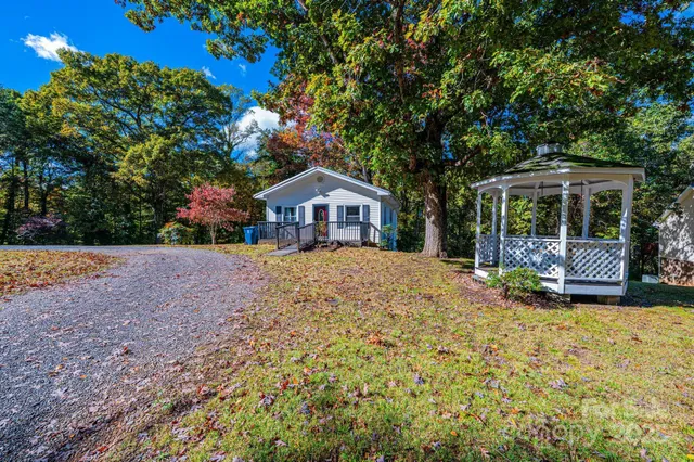 a view of house with yard and entertaining space
