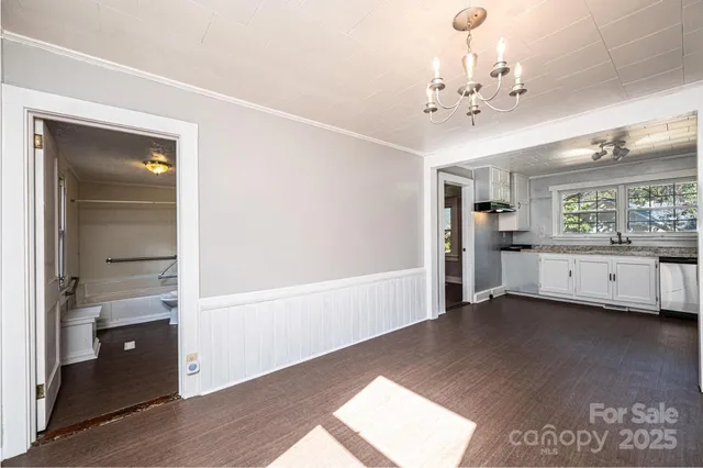 a bathroom with a shower toilet and sink