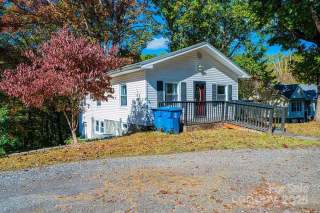 a view of a house with a yard covered with snow in front of house