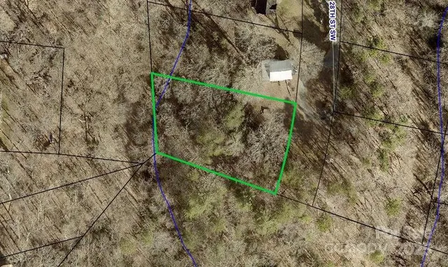 a wooden bench sitting in front of a house