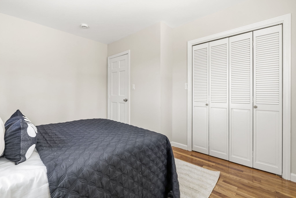 500 Franklin Street Wrentham, MA 02093 - Photo 17 of 34 a bedroom with a bed and wooden floor