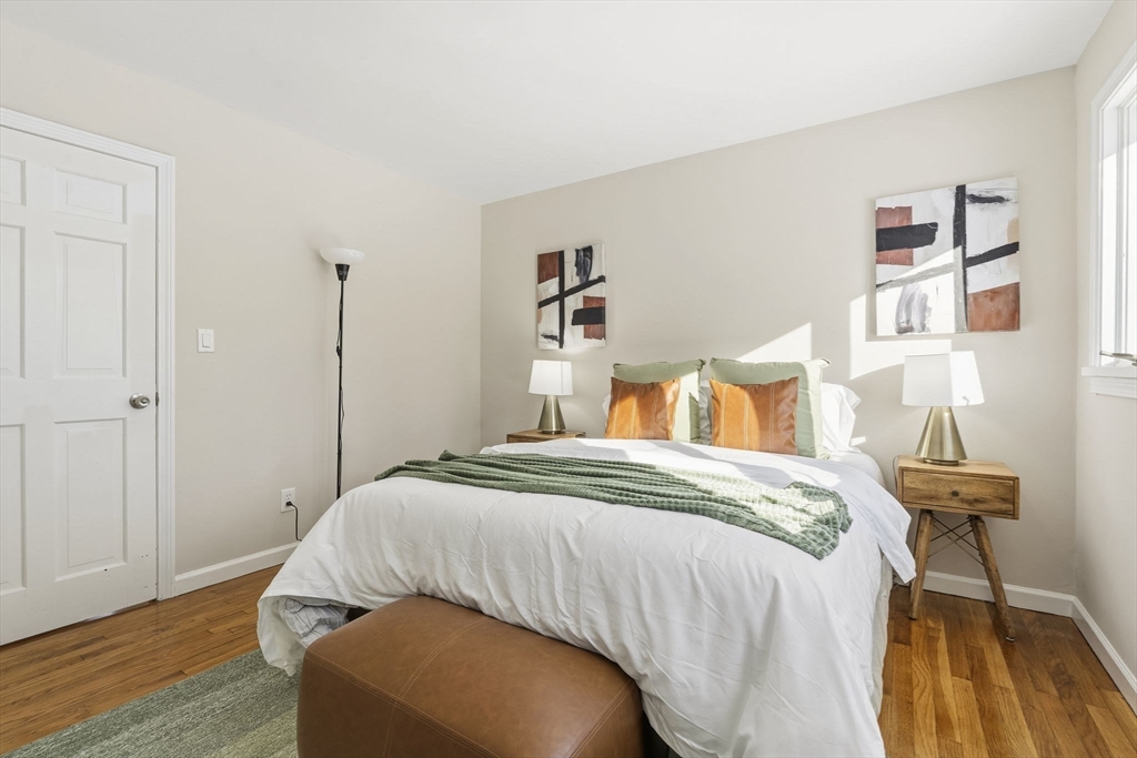 500 Franklin Street Wrentham, MA 02093 - Photo 19 of 34 a bedroom with a bed and a potted plant
