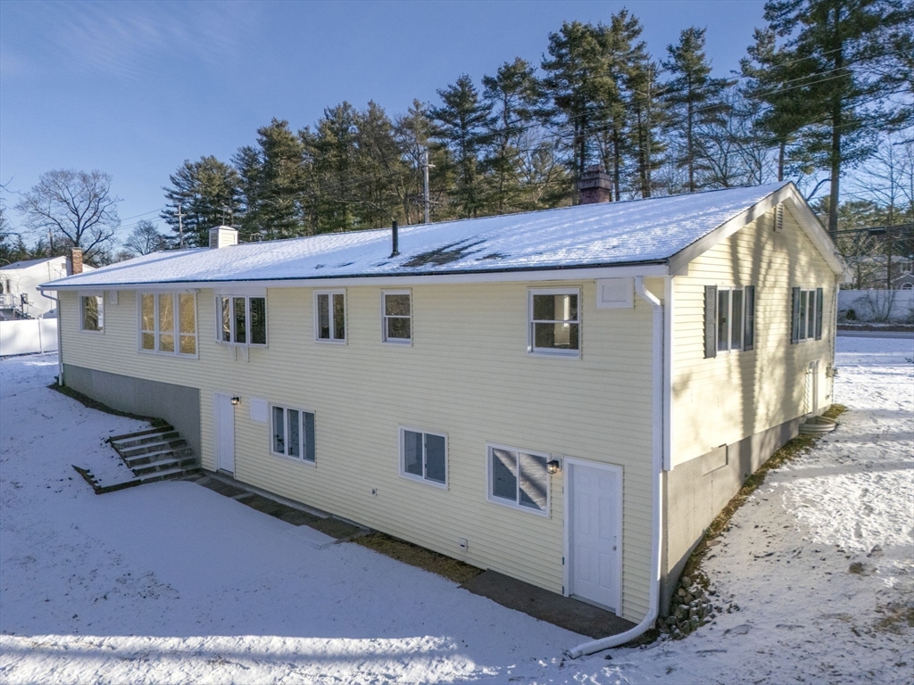 500 Franklin Street Wrentham, MA 02093 - Photo 2 of 34 a view of a white house with a big yard and large tree