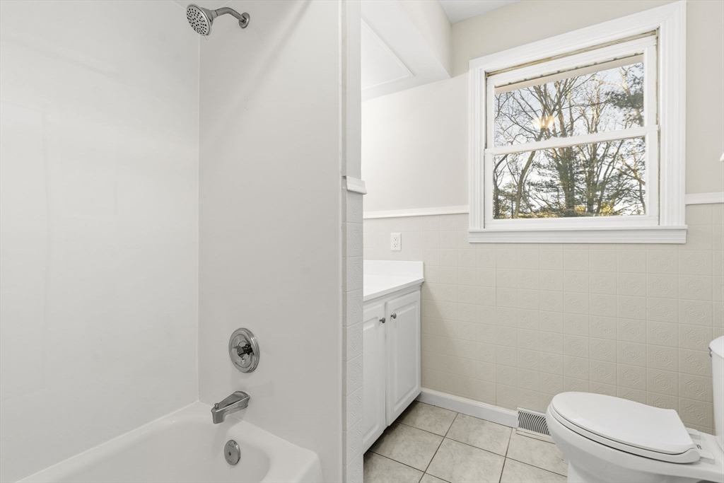 500 Franklin Street Wrentham, MA 02093 - Photo 21 of 34 a bathroom with a bathtub and window