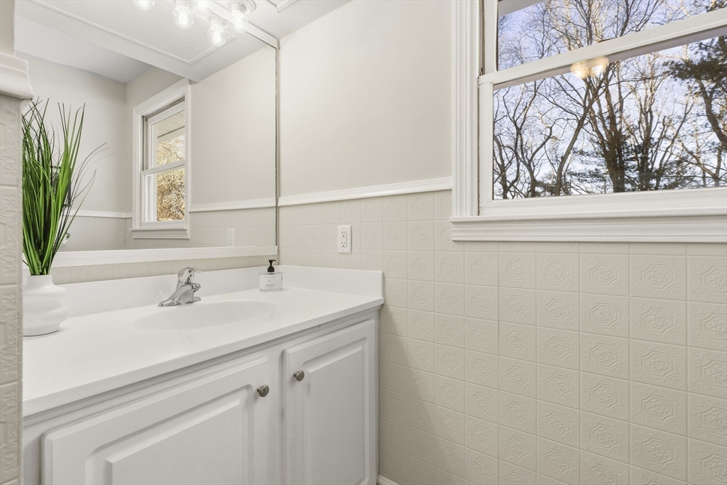 500 Franklin Street Wrentham, MA 02093 - Photo 22 of 34 a bathroom with a sink and a large mirror