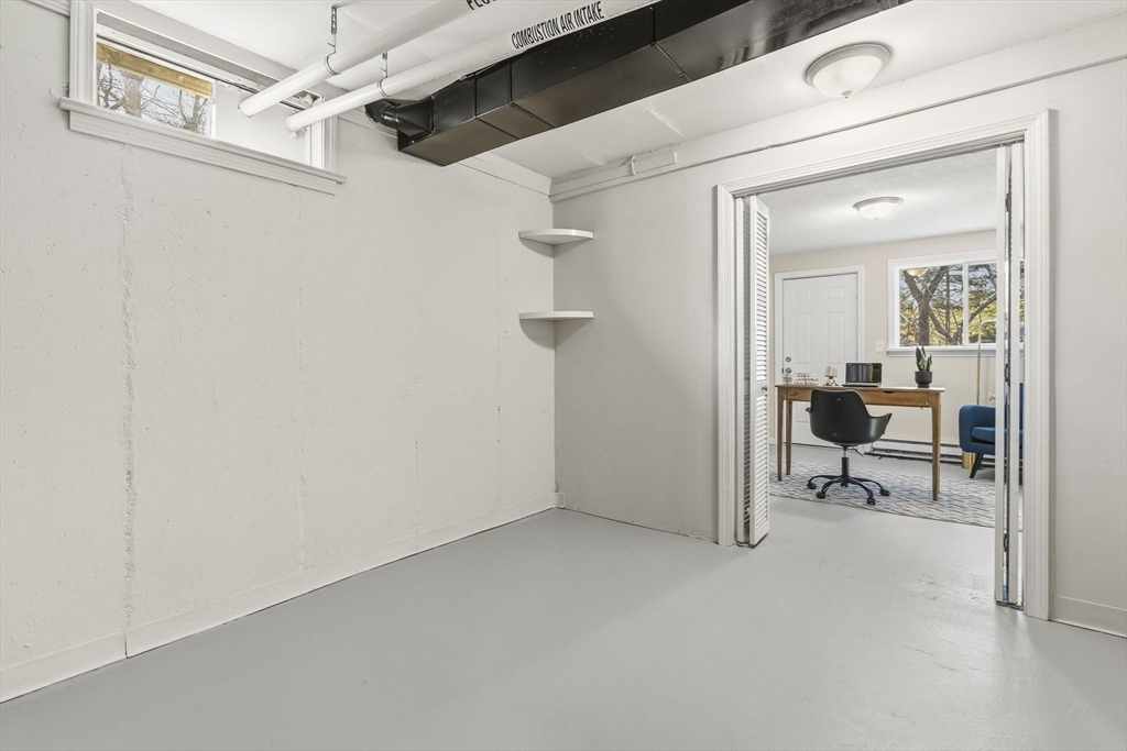 500 Franklin Street Wrentham, MA 02093 - Photo 29 of 34 a view of a livingroom with a chair and glass door