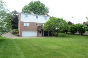 128 Herbst Road Coraopolis, PA 15108 - Photo 21 of 24 a front view of a house with a yard and trees
