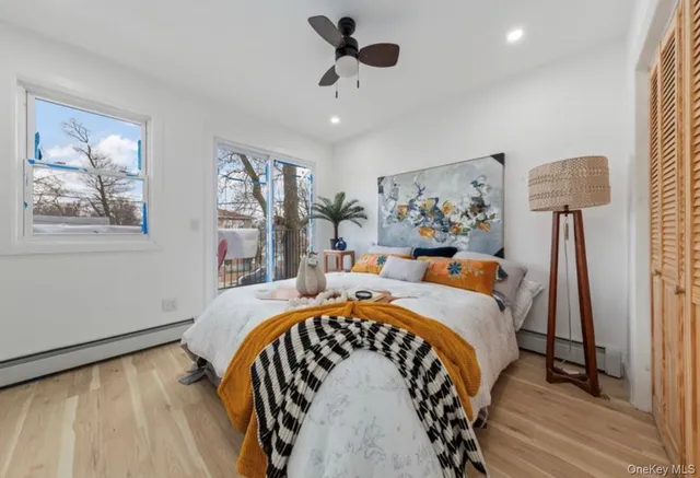 a bed room with a bed and a chandelier