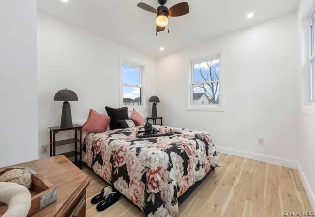 a bedroom with bed and a window