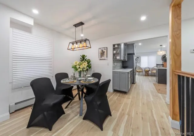 a dining room with furniture and window