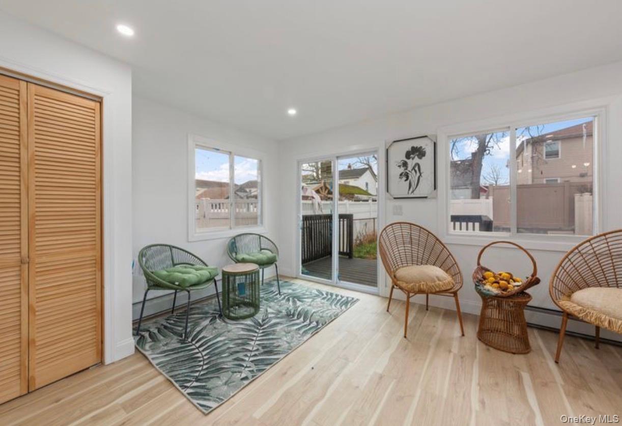 136-18 221st Street Queens, NY 11413 - Photo 9 of 23 Sitting room with light wood-style flooring and recessed lighting