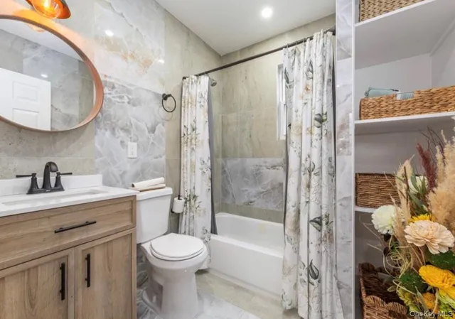 a bathroom with a toilet a sink and a bathtub