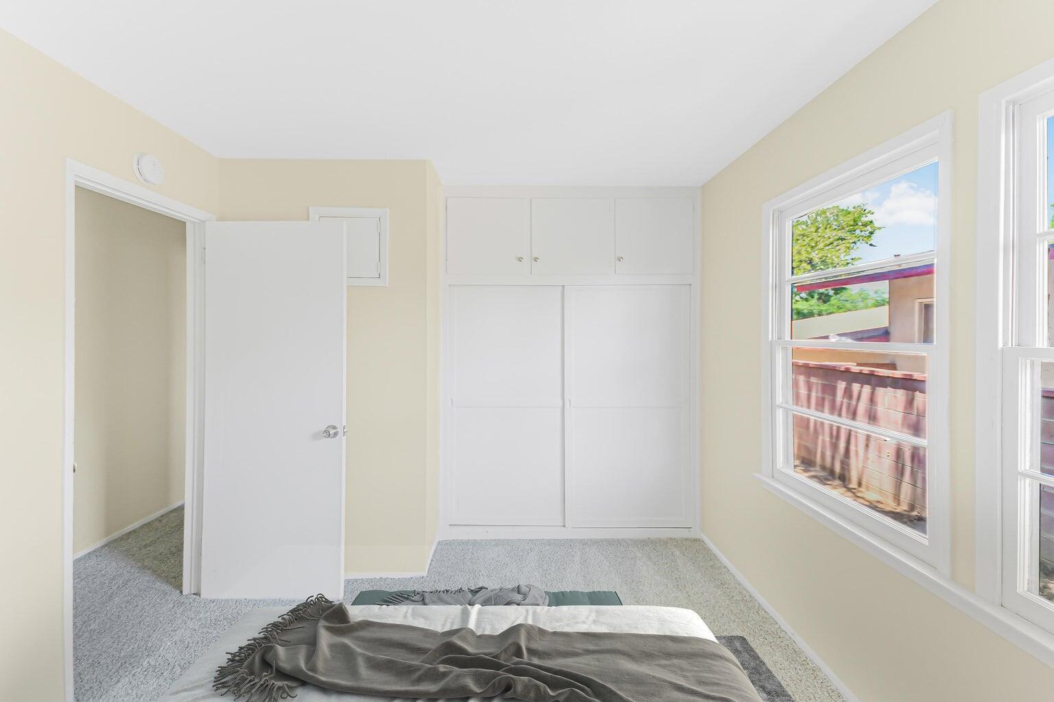 44446 Loneoak Avenue Lancaster, CA 93534 - Photo 13 of 20 a bedroom with a bed and a window