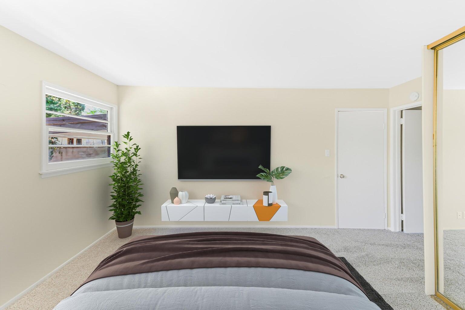 44446 Loneoak Avenue Lancaster, CA 93534 - Photo 15 of 20 a bedroom with a bed and a flat screen tv