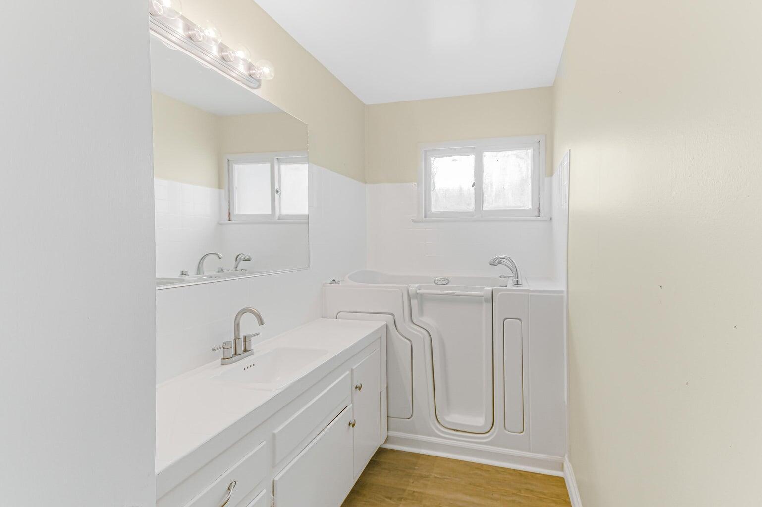 44446 Loneoak Avenue Lancaster, CA 93534 - Photo 16 of 20 a bathroom with 2 sink and a mirror