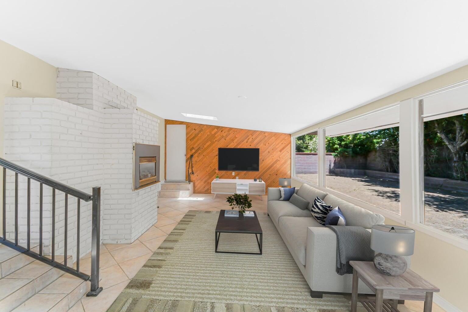 44446 Loneoak Avenue Lancaster, CA 93534 - Photo 4 of 20 a living room with furniture wooden floor and a flat screen tv