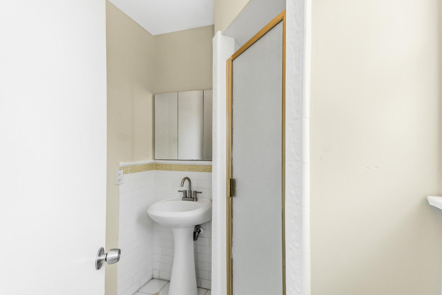 44446 Loneoak Avenue Lancaster, CA 93534 - Photo 9 of 20 a bathroom with a sink and mirror