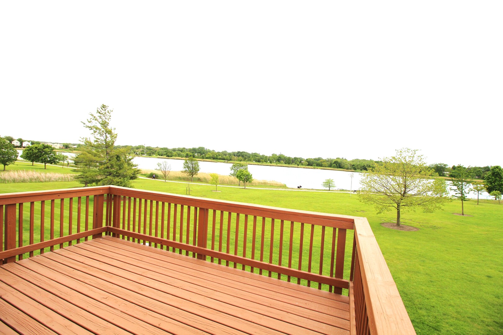 25 Oak Park Road Bloomington, IL 61701 - Photo 28 of 28 a view of a balcony with wooden floor and ocean view