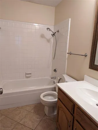 a bathroom with a sink a toilet and a bathtub