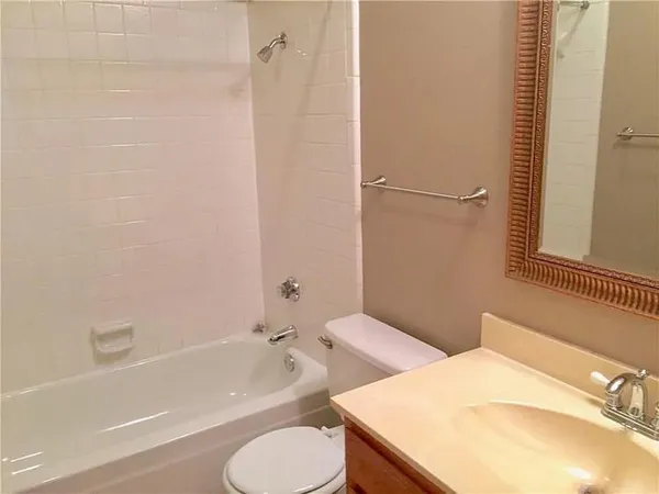 a bathroom with a sink toilet and bathtub