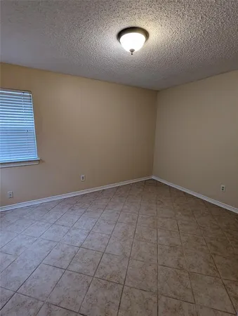 an empty room with a bench