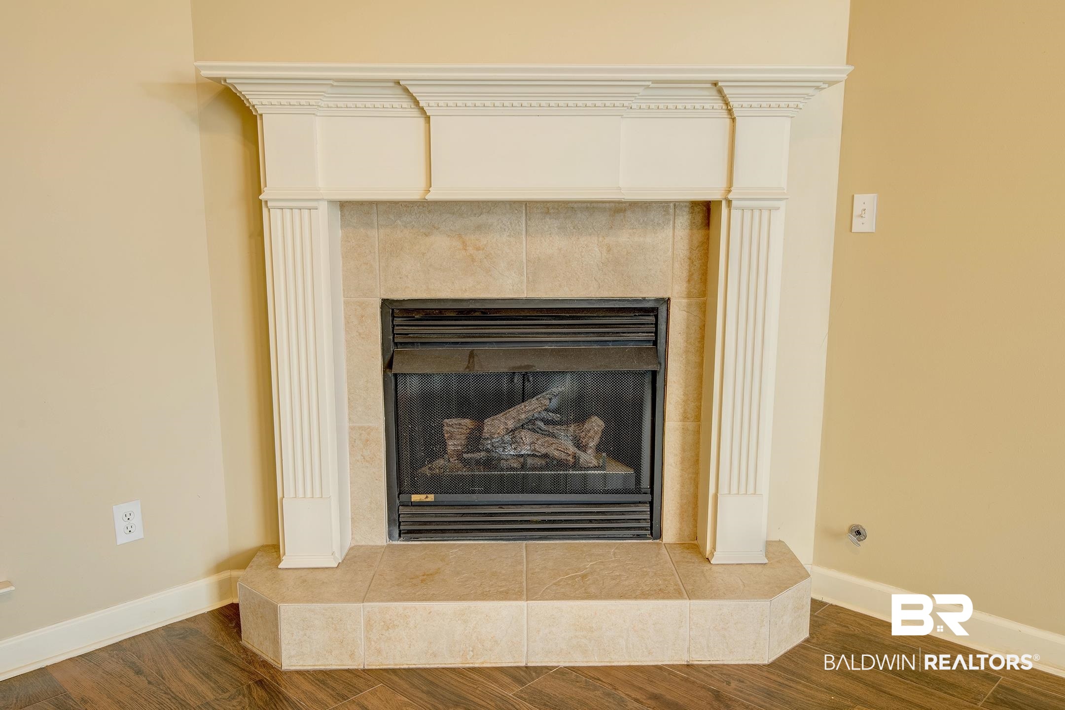 9421 Collier Loop Daphne, AL 36526 - Photo 9 of 31 Detailed view of wood finished floors and a tiled fireplace