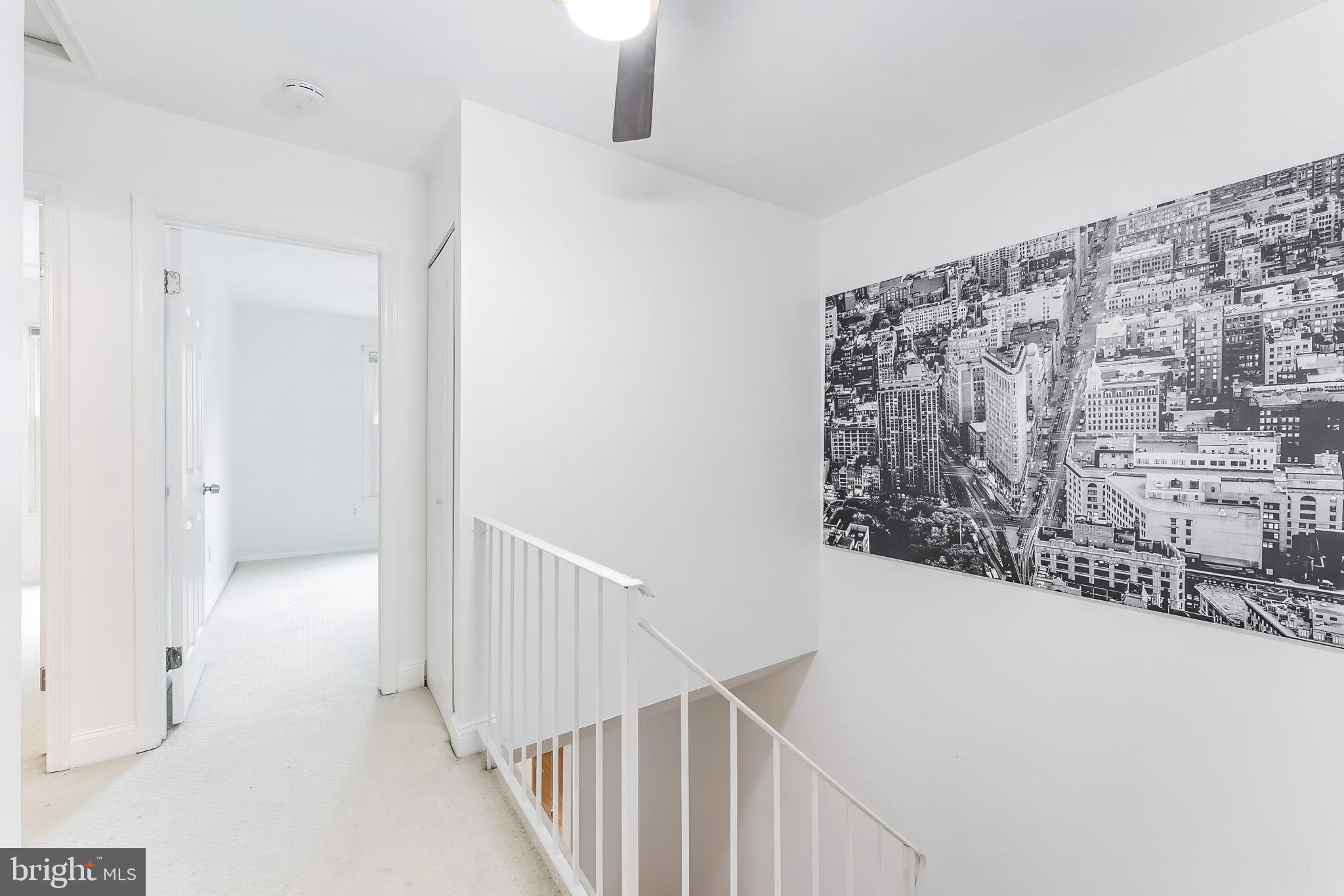 2331 Harleyford Court Reston, VA 20191 - Photo 26 of 40 Modern staircase with urban art.