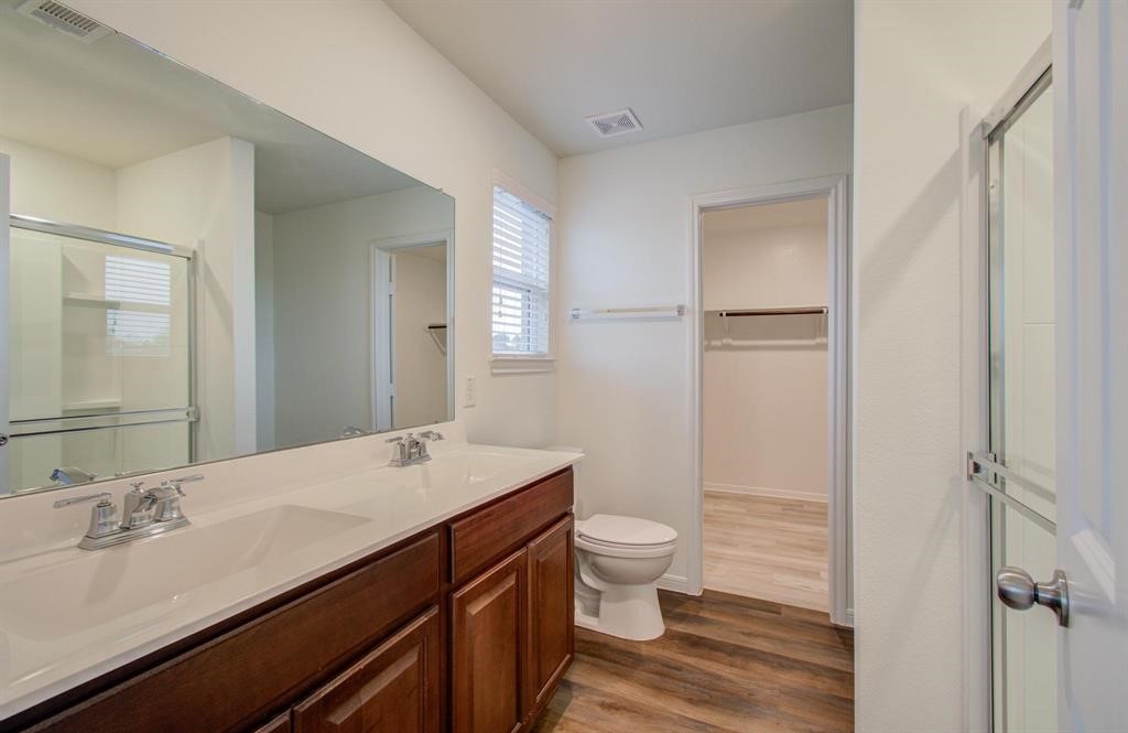 4627 Prairie Chase Drive Houston, TX 77069 - Photo 13 of 23 Primary Bathroom — Contemporary bathroom featuring updated tile, a sleek vanity, modern fixtures, and a spa-inspired design. Clean, bright, and beautifully refreshed.