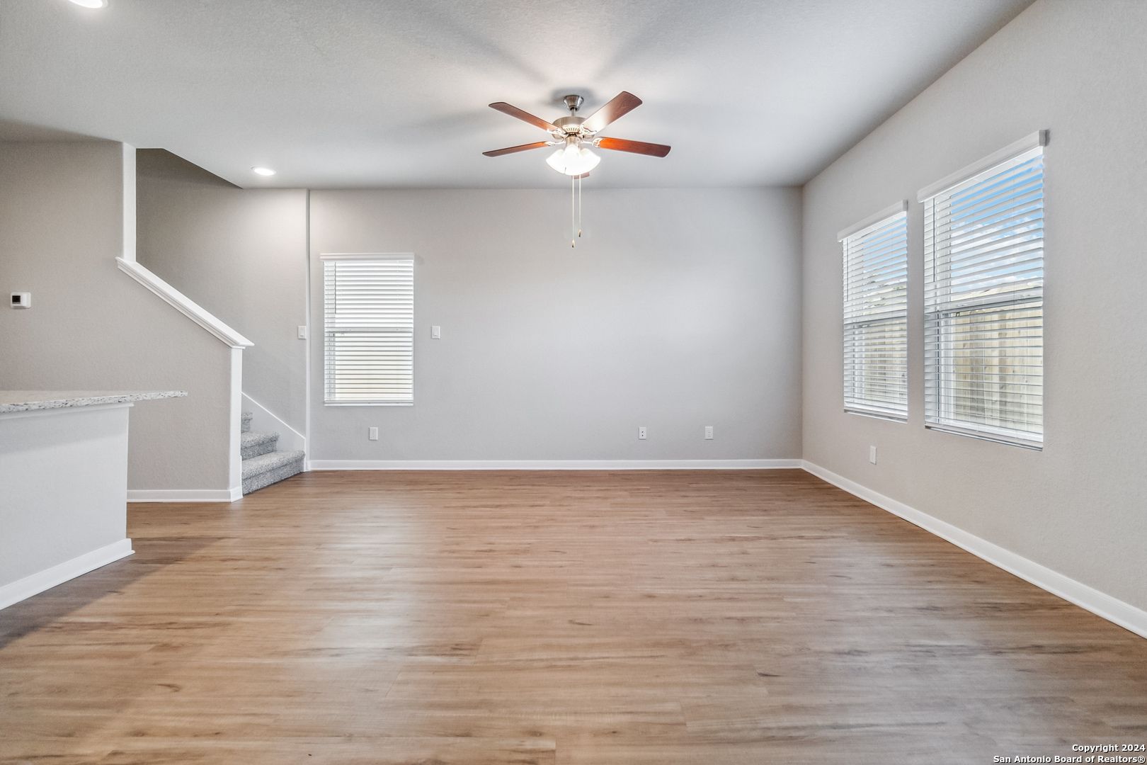 3928 Abbott Pass St. Hedwig, TX 78152 - Photo 15 of 45 a view of an empty room with wooden floor and a window