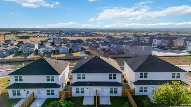 an aerial view of a house with a ocean view