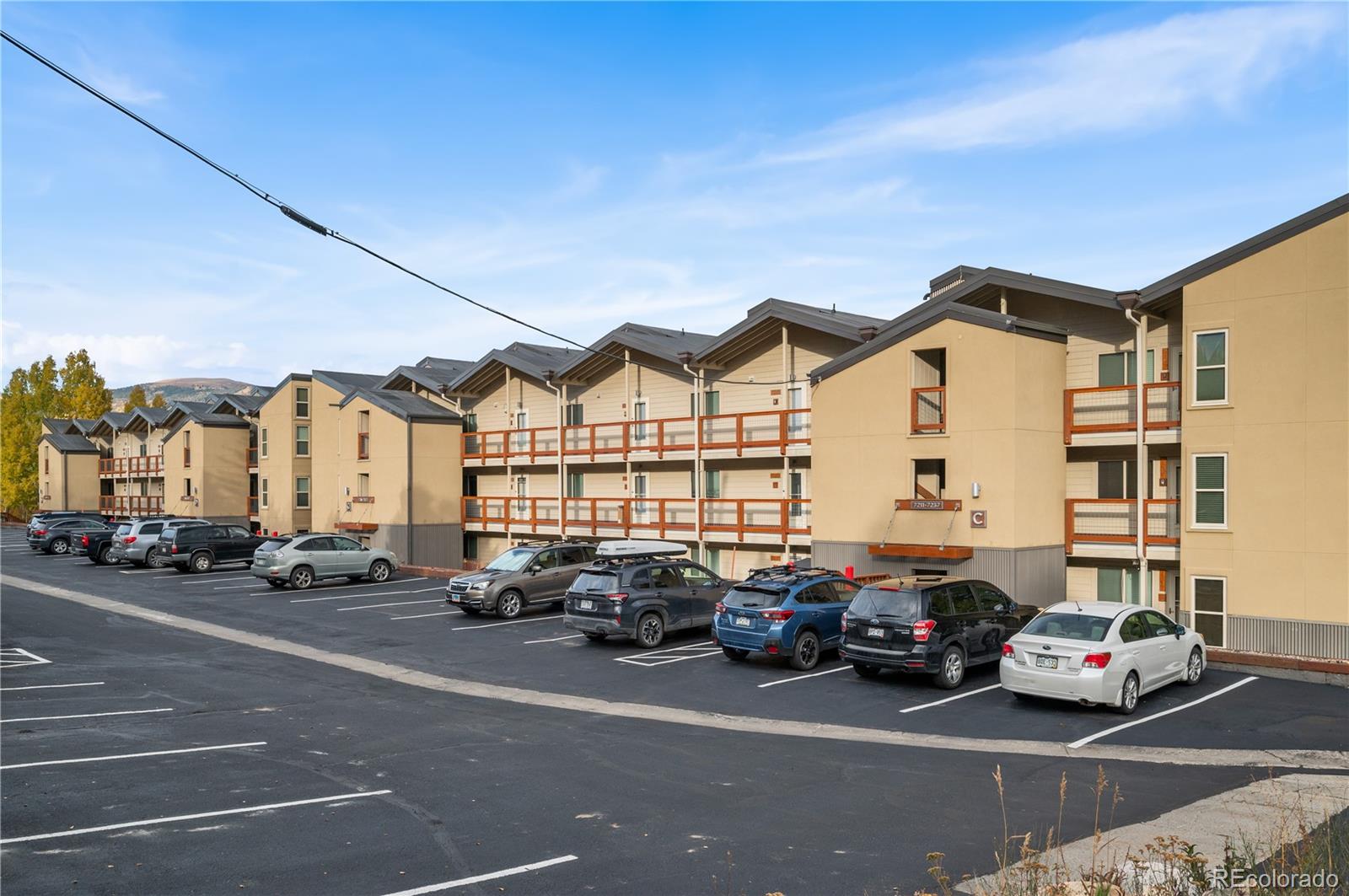 7222 Ryan Gulch Road, Unit 202 Silverthorne, CO 80498 - Photo 2 of 36 a car parked in front of a house