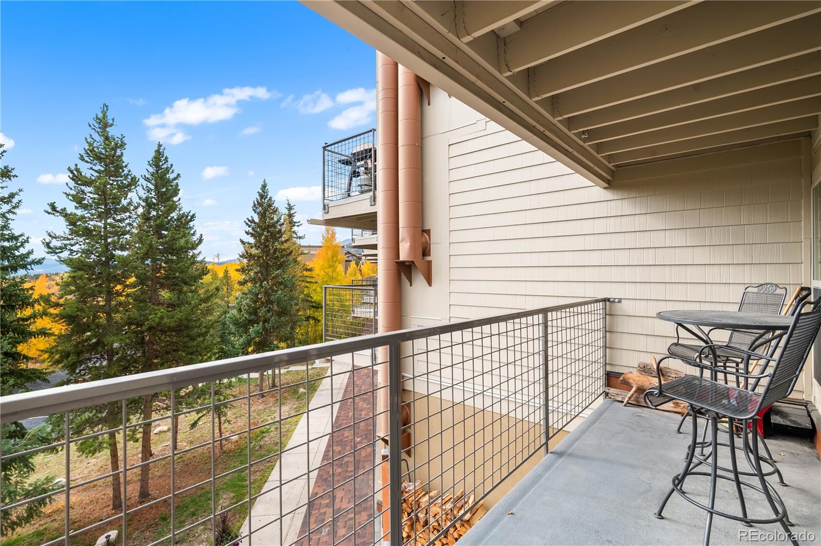7222 Ryan Gulch Road, Unit 202 Silverthorne, CO 80498 - Photo 21 of 36 a view of a balcony with chairs