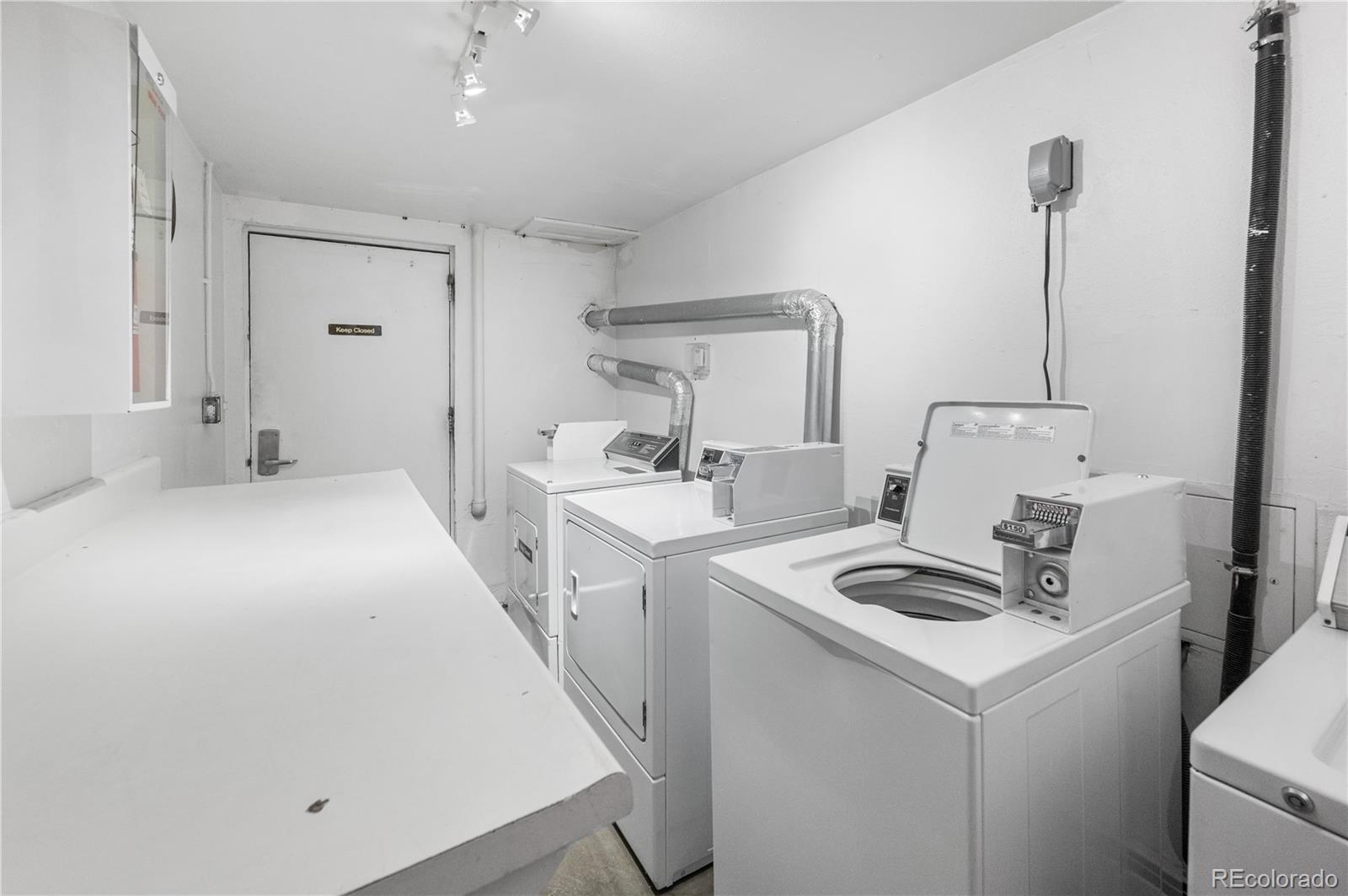 7222 Ryan Gulch Road, Unit 202 Silverthorne, CO 80498 - Photo 23 of 36 a kitchen that has a sink and a stove