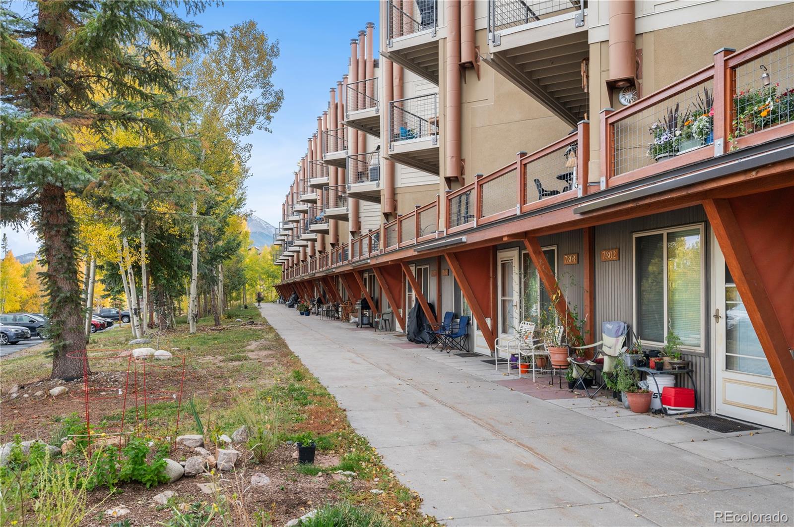 7222 Ryan Gulch Road, Unit 202 Silverthorne, CO 80498 - Photo 3 of 36 a view of a large white house