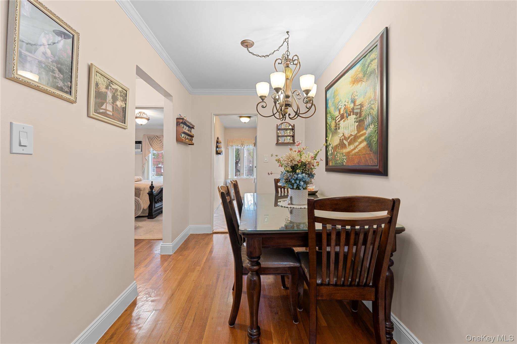 301 Bay 19th Street, Unit B Brooklyn, NY 11214 - Photo 8 of 13 a view of a dining room with furniture and chandelier