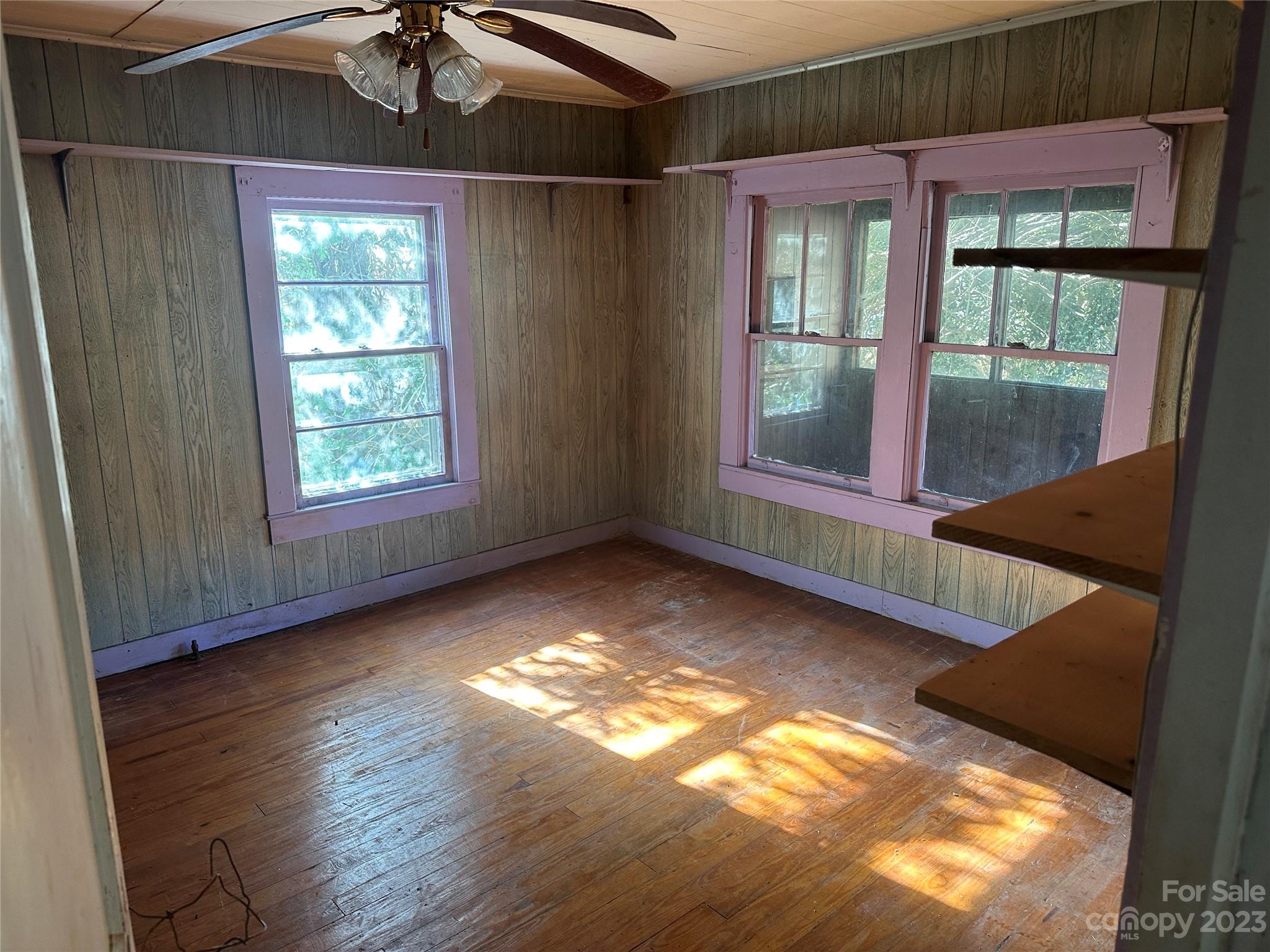 1495 Memorial Park Road Lancaster, SC 29720 - Photo 10 of 13 an empty room with wooden floor and windows