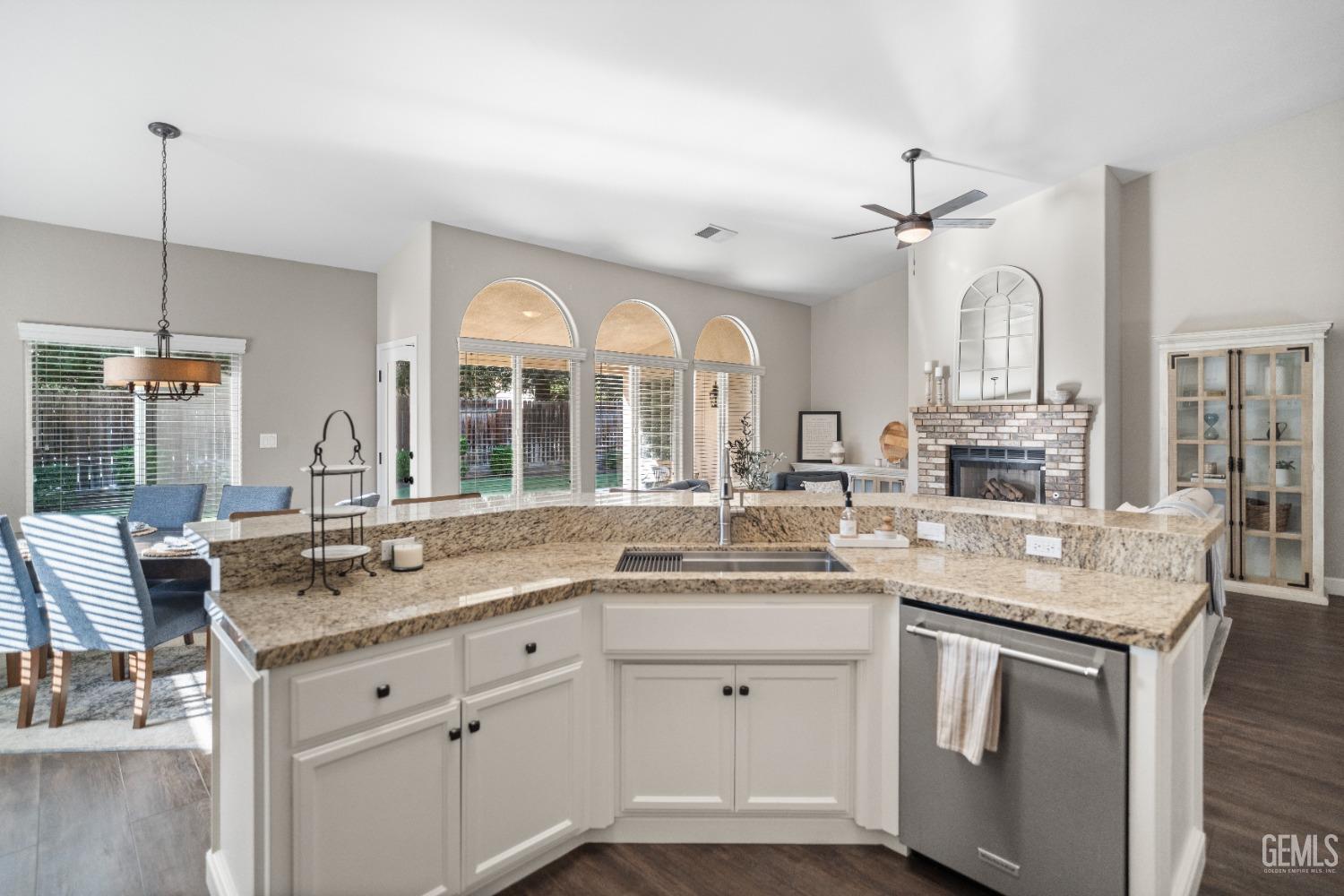 Undisclosed Address Bakersfield, CA 93308 - Photo 16 of 37 a kitchen with a sink stove and cabinets