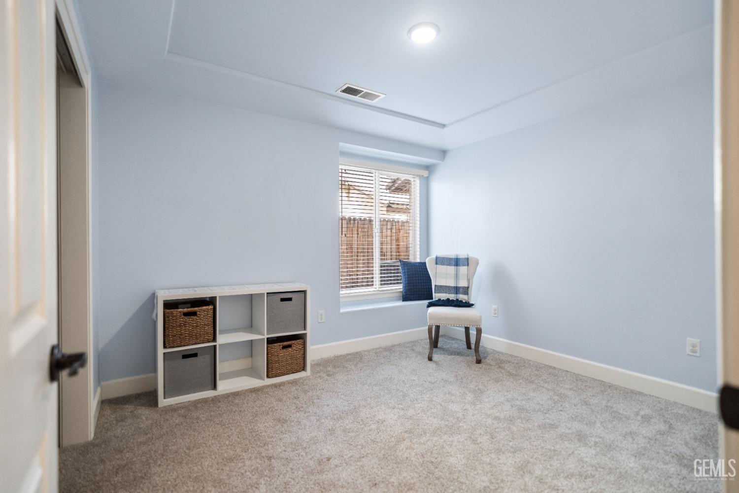 Undisclosed Address Bakersfield, CA 93308 - Photo 23 of 37 a living room with furniture and natural light