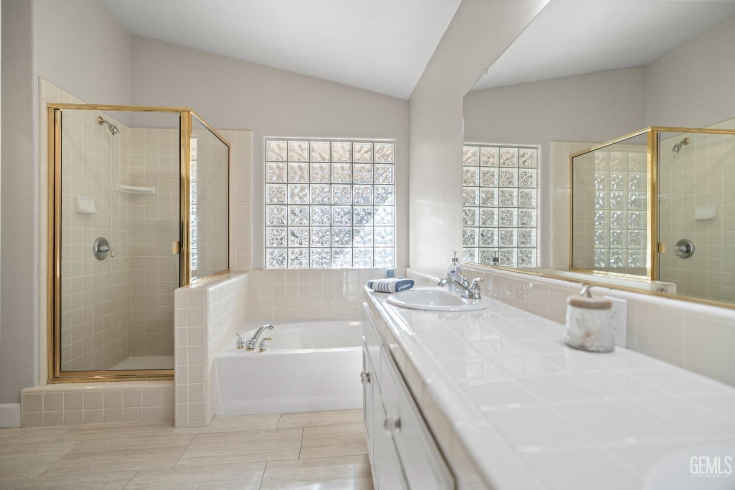 Undisclosed Address Bakersfield, CA 93308 - Photo 27 of 37 a spacious bathroom with sink and bathtub