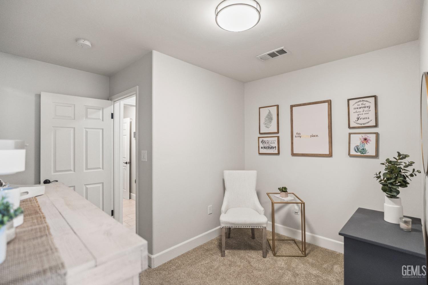 Undisclosed Address Bakersfield, CA 93308 - Photo 31 of 37 a living room with furniture and flowers