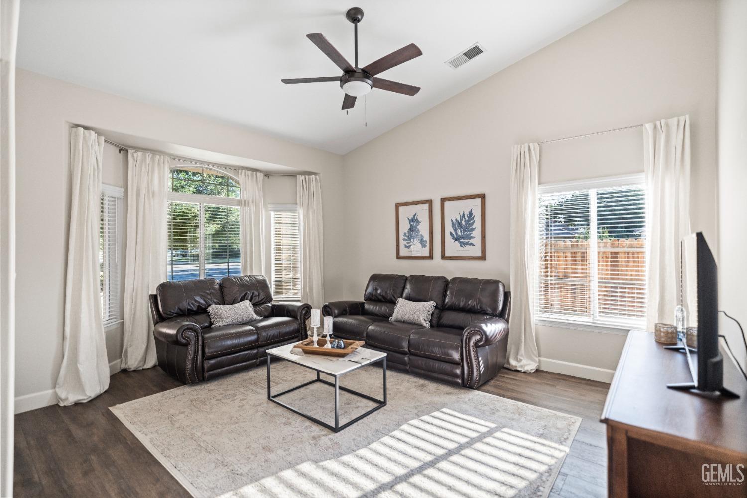 Undisclosed Address Bakersfield, CA 93308 - Photo 4 of 37 a living room with furniture a flat screen tv and a window