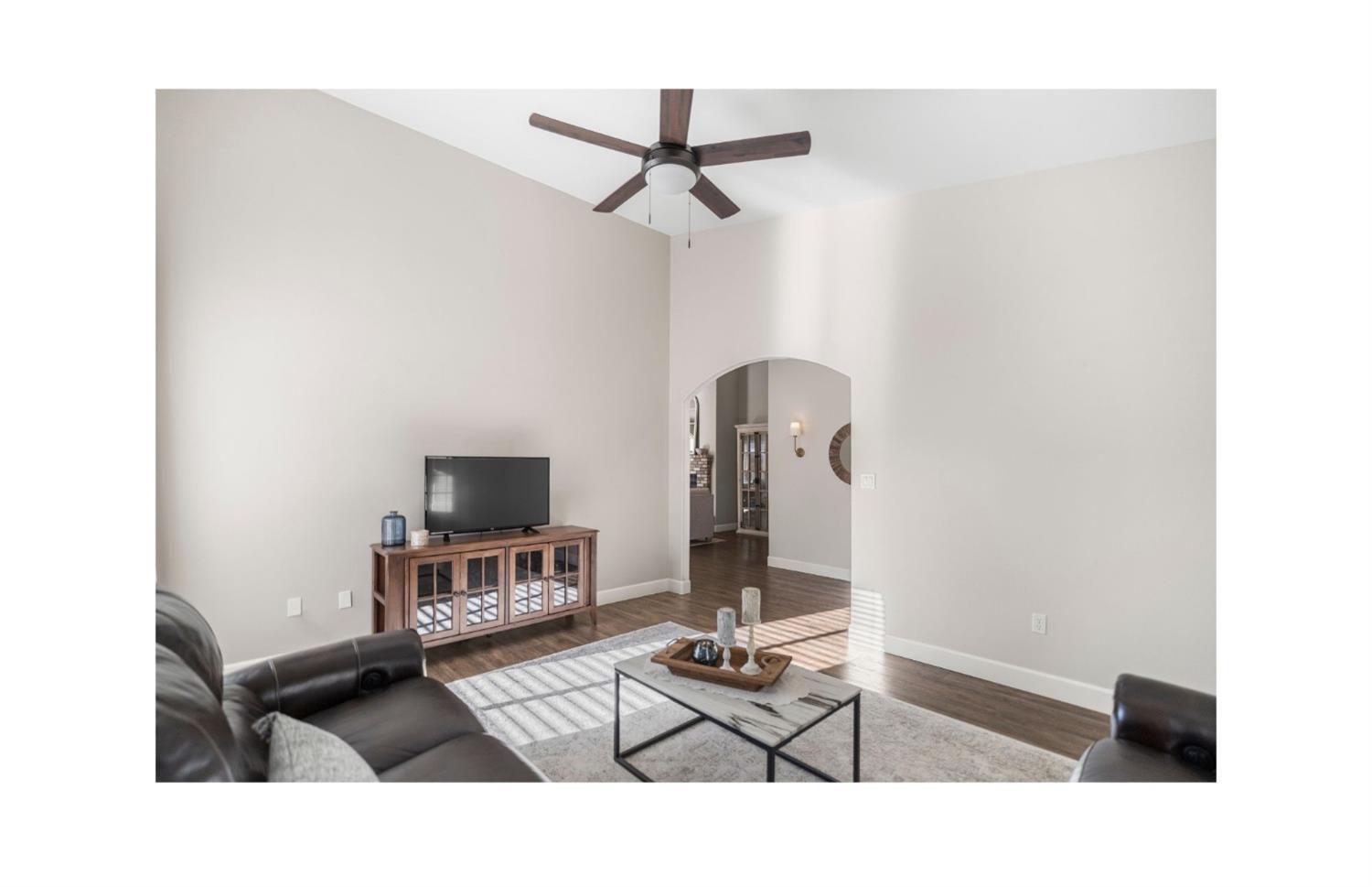 Undisclosed Address Bakersfield, CA 93308 - Photo 5 of 37 a living room with furniture and a flat screen tv