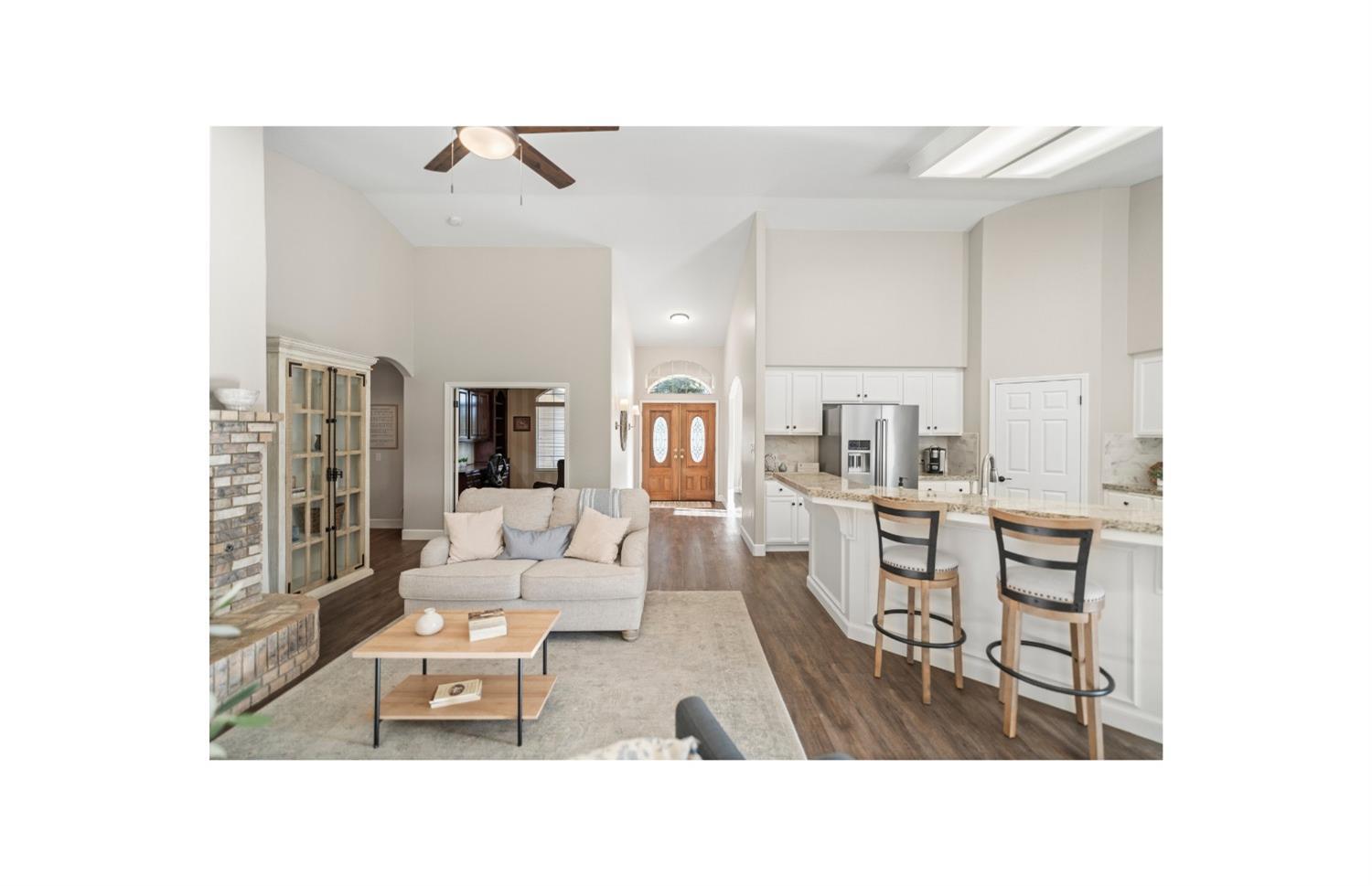 Undisclosed Address Bakersfield, CA 93308 - Photo 7 of 37 a living room with furniture and a table