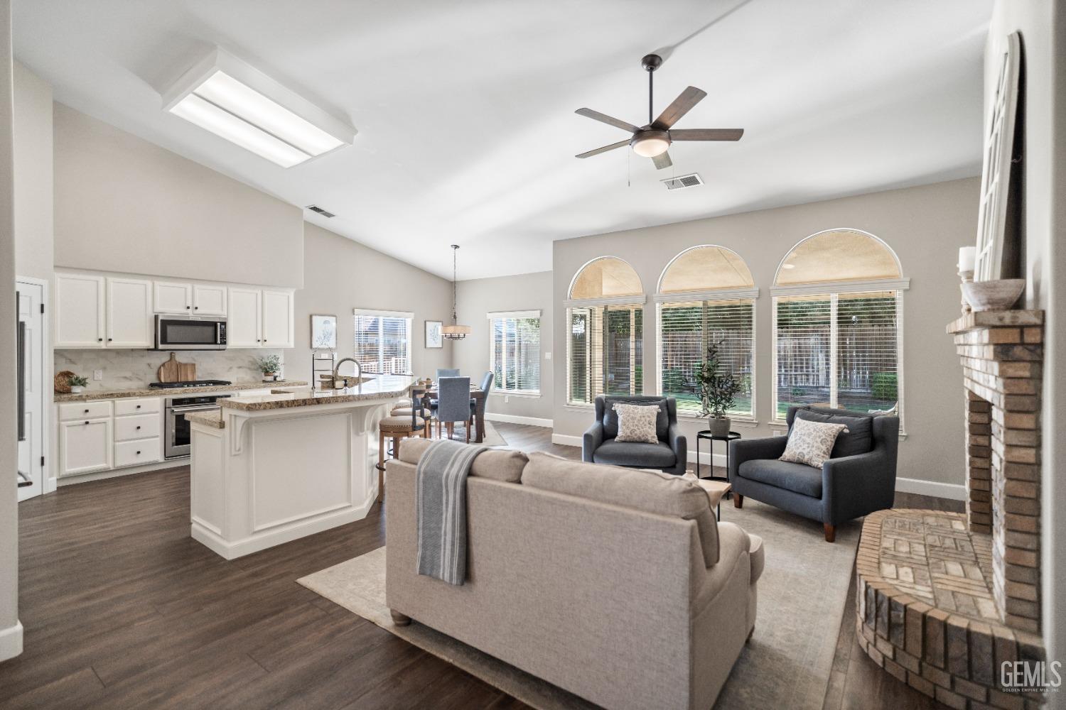 Undisclosed Address Bakersfield, CA 93308 - Photo 8 of 37 a living room with furniture and kitchen view
