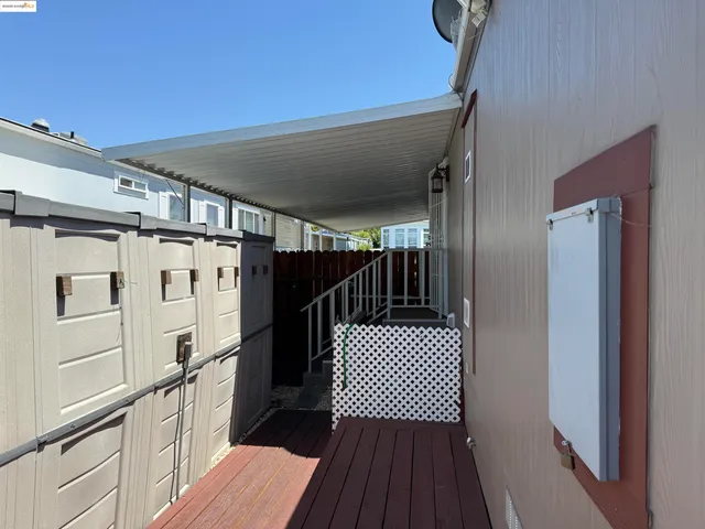 a view of a balcony with wooden floor