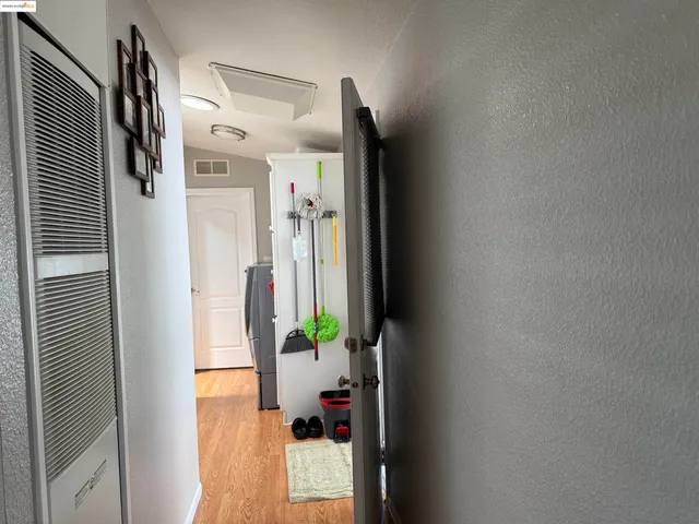 a bathroom with a shower curtain and a mirror