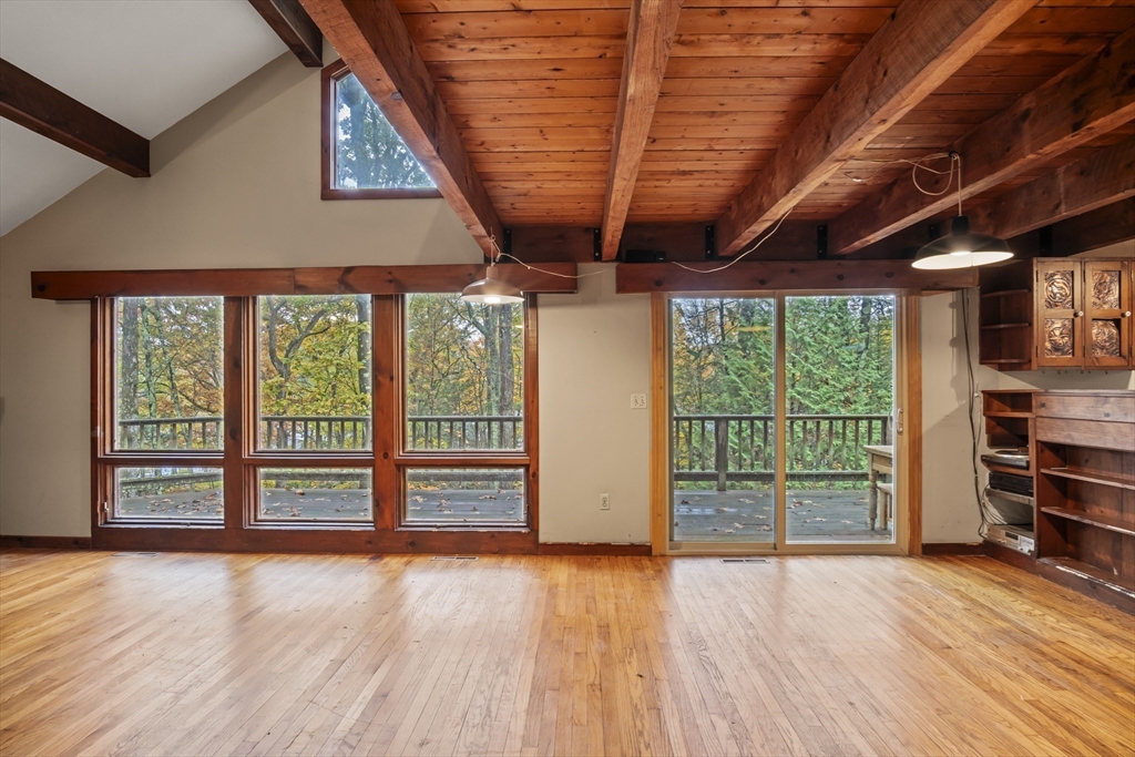 55 Putney Road Leverett, MA 01054 - Photo 14 of 40 an empty room with wooden floor and balcony