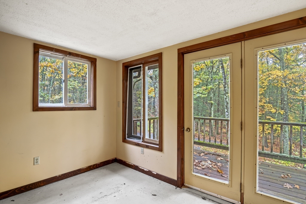 55 Putney Road Leverett, MA 01054 - Photo 18 of 40 a view of an empty room with windows