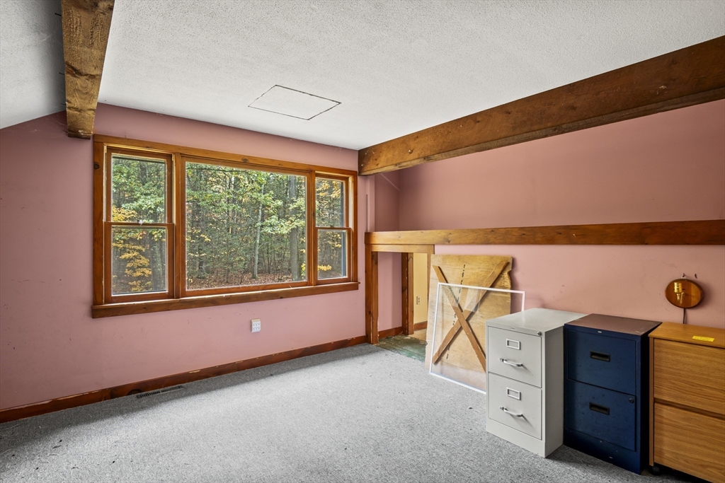 55 Putney Road Leverett, MA 01054 - Photo 22 of 40 a view of an empty room with a window