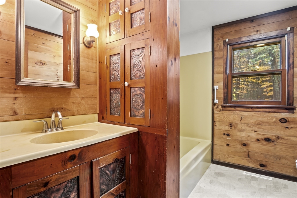 55 Putney Road Leverett, MA 01054 - Photo 23 of 40 a bathroom with a sink a vanity and a mirror